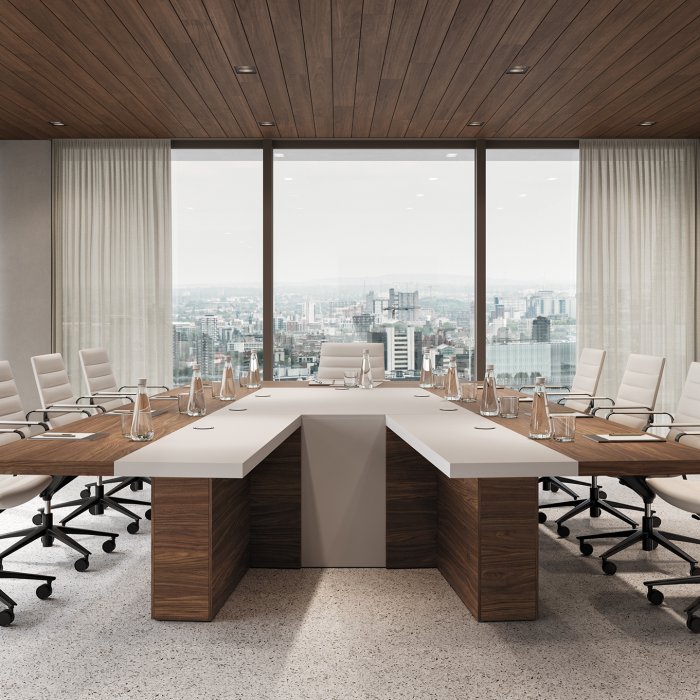 Ovale Italiaanse vergadertafel met geïntegreerd kabelmanagement in een lichte Nederlandse directiekamer
